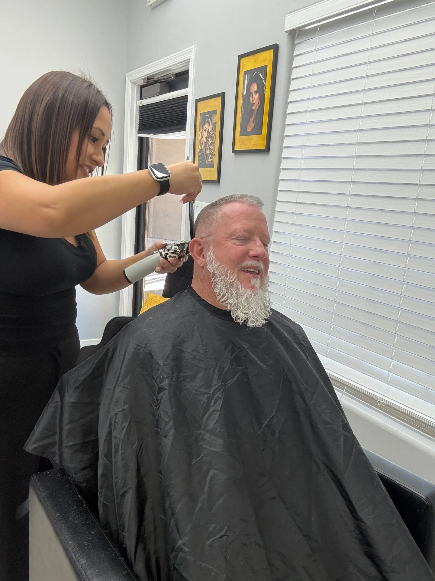 Detail trim around the ear during a men's haircut at Hair Ambition mobile barber in Goodyear, AZ