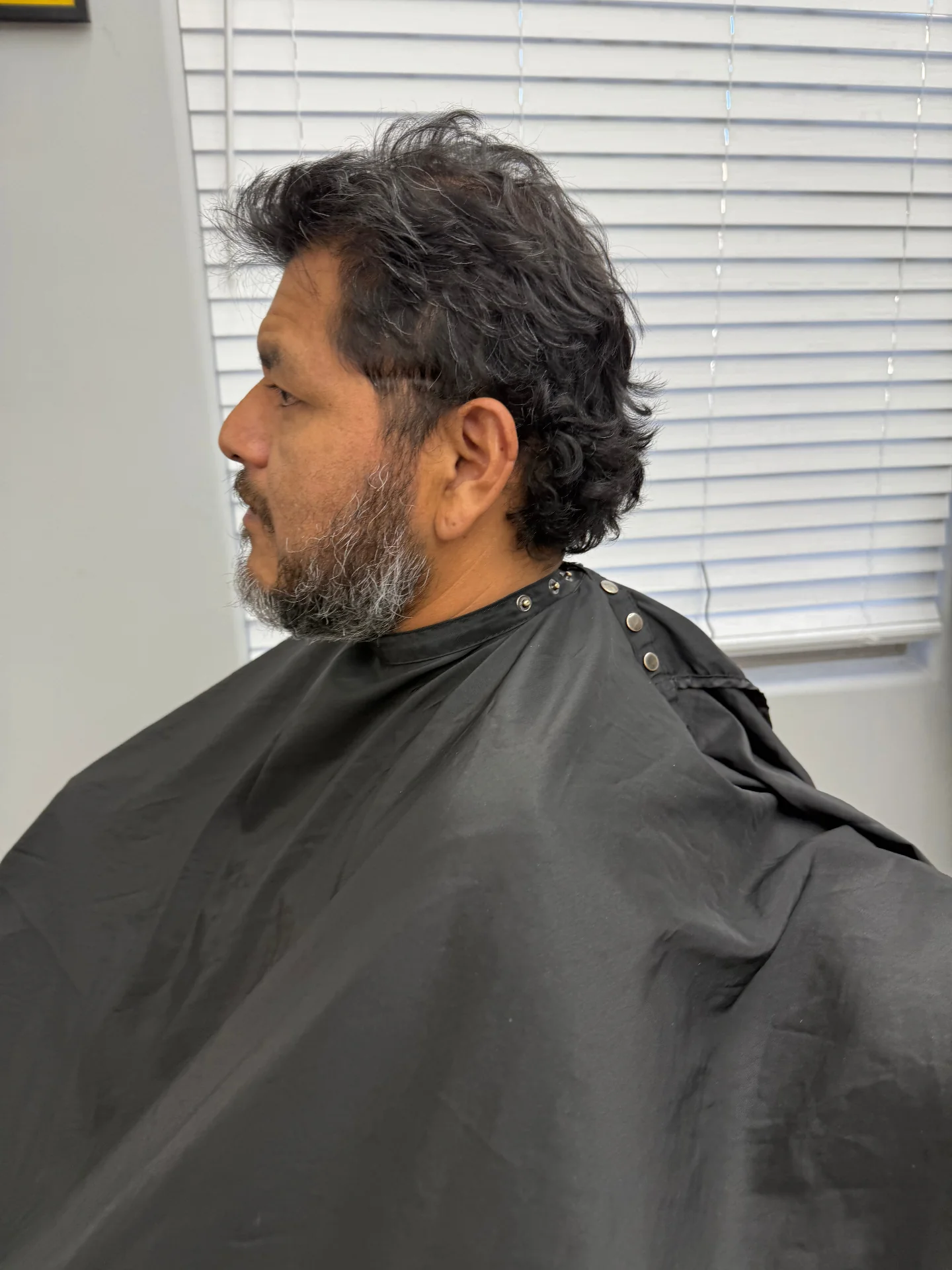 Client before haircut and beard trim at Hair Ambition mobile barber in Goodyear, AZ