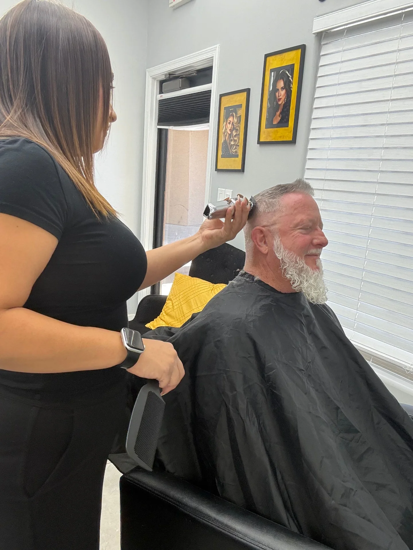 Clipper work on the back of the head during a men's haircut at Hair Ambition mobile barber in Goodyear, AZ